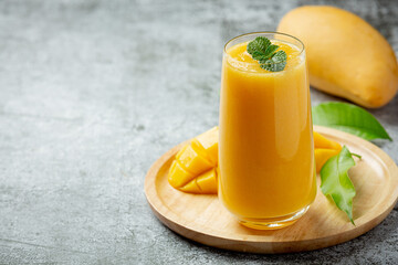 Mango juice in the glass on dark backgroud