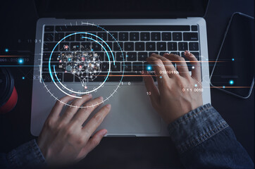 Ai Artficial Intelligence, IoT Internet of Things concept, man working on laptop computer with brain representing Ai interface