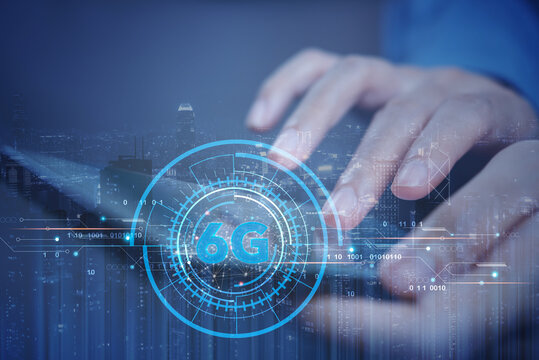 Person using smartphone with 6G network digital hologram and internet of things on city background