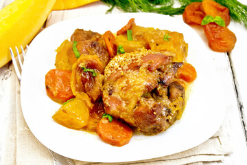 Chicken roast with pumpkin and carrots on light board