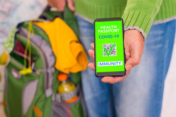 Caucasian people shows health passport of immunity for people vaccinated of coronavirus covid-19....