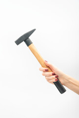 Female hand with red manicure holds hammer. On white background.