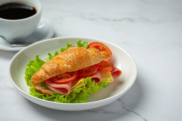 croissant sandwiches on dark wooden backgroud