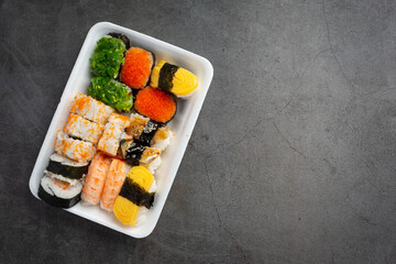 Traditional sushi on dark background