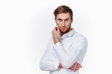 portrait of a confident man in a white shirt on a light background and a thick beard blond model