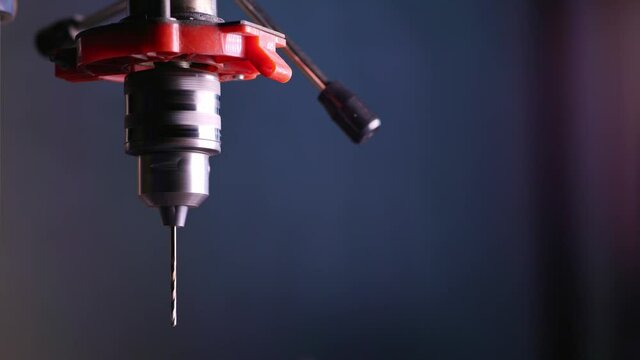 Drilling machine rotation at the workplace of a toolman locksmith
