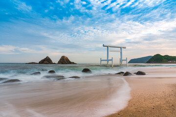 Sakurai Futamigaura's sacred Couple Stones and torii gate view from de beach in Itoshima, Fukuoka, Japan scenic landscape