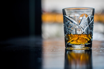 Whisky glass on a wooden surface