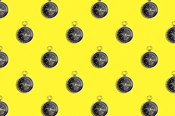 Pattern of compass. Trendy background of compass on a yellow background. Colorful pattern. View from above