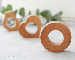 Wooden napkin rings for table setting. Unusual form napkin holders from oak wood. Table decor.