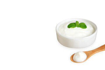 Yogurt in ceramic bowl with mint leaf and wooden spoon, Isolated on white background with copy space, Milk curd organic homemade, Processed dairy products for Health care and Healthy food concept.