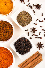 spices in ceramic bowls and white background stock photo
