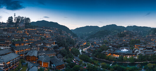 Fototapeta na wymiar Night view of Qianhu Miao village in Xijiang, Qiandongnan, Guizhou Province, China