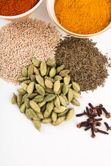  spices in ceramic bowls and on ground With white background stock photo