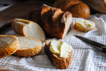 Fresh bread on the table, bruschetta with butter.