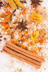 Spices: Turmeric, Chilly powder, Cardamom and cinnamon, anise stars on ground with white background, top view stock photo