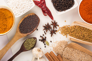 Wooden spoon with mixed spices top view stock photo