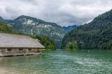Fototapeta premium KONIGSEE, GERMANY, 3 AUGUST 2020: Wooden houses on the banks of Konigsee Lake