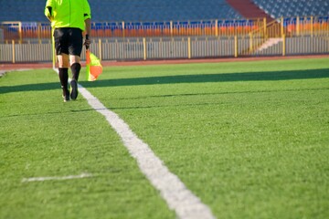 Fototapeta premium STADIUM - Football field with goal and tablo on blue sky