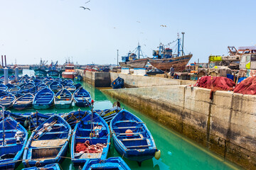 Fototapeta na wymiar Traditional blue boats in the harbor of Essaouira, Morocco