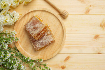 Fresh honeycombs on wooden backgroud