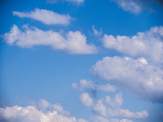 Naklejka na ściany i meble Cloud on blue sky background - zoom and details on clouds - free space to write - high resolution photo