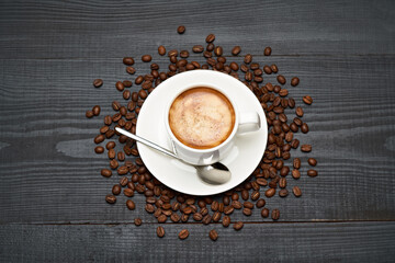 Cup of espresso coffee on dark wooden background