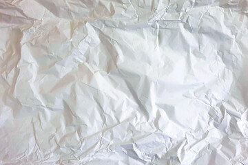 Obraz premium Crumpled white wrapping paper texture background. Top view