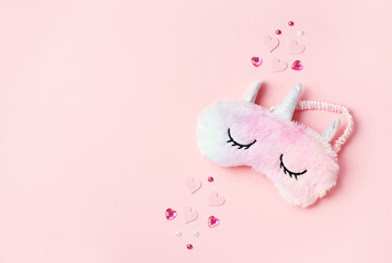Pink sleeping eye mask furry fur.Top view, flat lay. Concept relaxation and sweet dreams