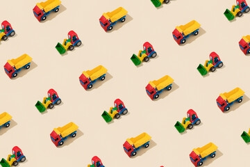 Naklejka premium Truck and Tractor Creative Pattern on Yellow Background - Top View