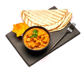 Plate of Traditional Chicken Curry on stone serving board isolated on white background