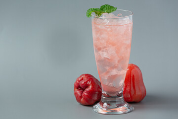 Rose apple juice on white background