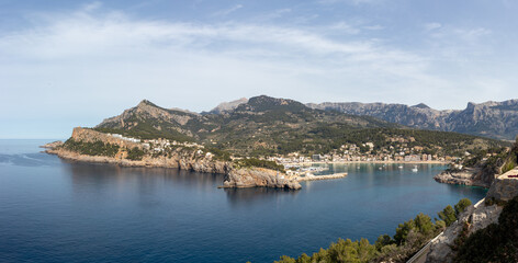 Fototapeta premium Panoramic view of port de soller with lighthouse and bay, mallorca spain.