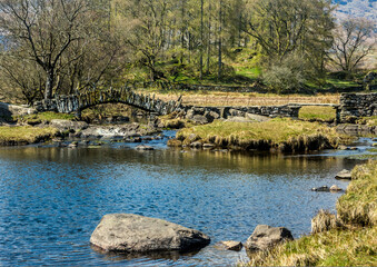 Slaters Bridge crosses the River Brathay in Cumbria, UK.