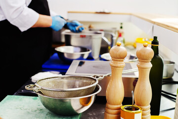 Kitchen with utensils and spices in a small restaurant. Cooking food for tourists and locals. Foreground