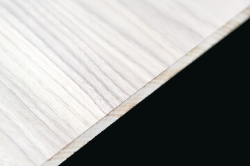 A fragment of a veneer board in light colors. Material for the manufacture of furniture and other decorative elements. Flat lay frame