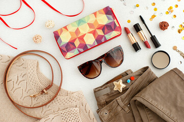 Accessories and clothing for women. Jeans, blouse, lipstick, belt, wallet, sunglasses, mascara...