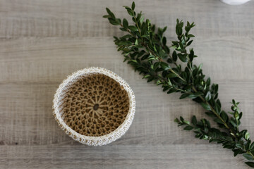 Handmade home decor made from organic jute fiber. wicker jute basket top view. the concept of home decor and comfort in the eco style.