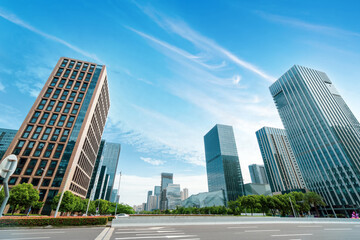 Fototapeta premium Skyscrapers by the road in the financial district, Ningbo, China.