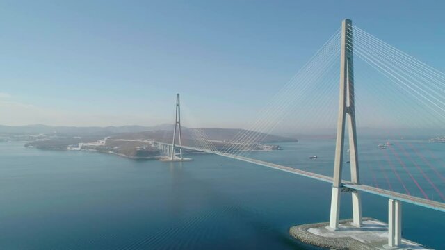 Aerial over the Russky road bridge. Bridge across the Eastern Bosphorus to Russky Island.
