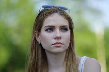 Portrait of a young beautiful girl in the park