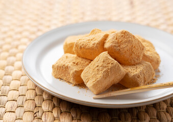 Warabi Mochi placed on a Japanese placemat.