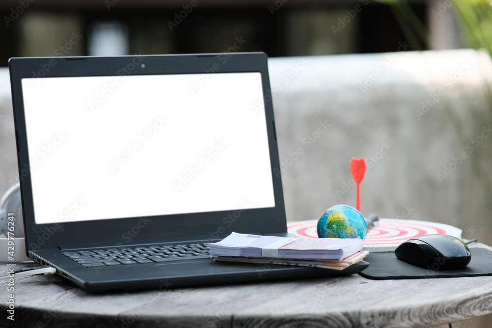 Sticker laptop computer on the table office background and work at home