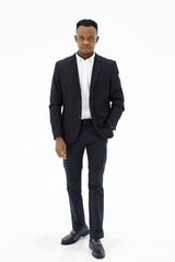 Image is a portrait. Happy and smile African American standing smart hand in his pocket with a black suit is a businessman In the studio with a white background.