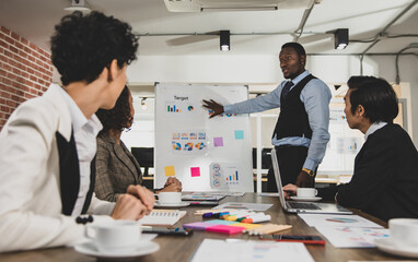 African Americans are leading graph business meetings with people of diversity nationalities in office conference rooms. Concept Diversity meeting business room.