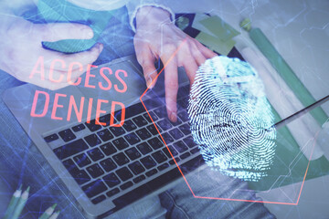 Double exposure of woman hands typing on computer and fingerprint drawing. Security concept.