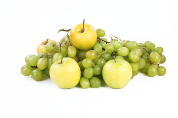 Still life with grapes and apples on a white background