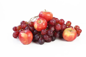Naklejka na ściany i meble Still life with grapes and apples on a white background
