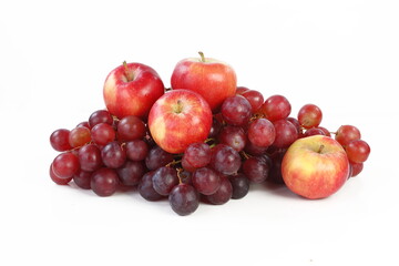 Still life with grapes and apples on a white background