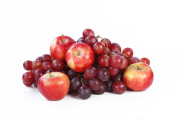 Naklejka na ściany i meble Still life with grapes and apples on a white background